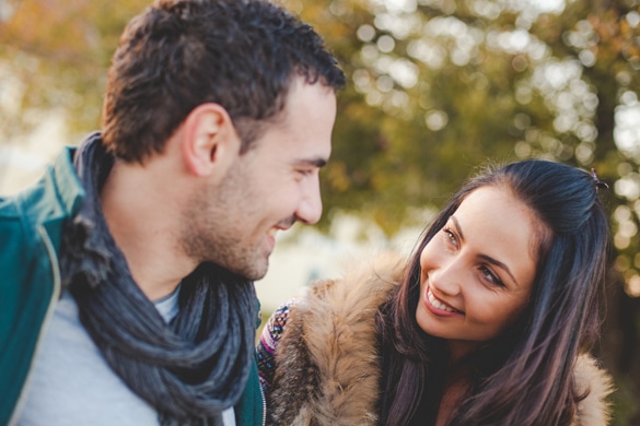 Young romantic couple on a bench in park - what are the very best things about Aries men