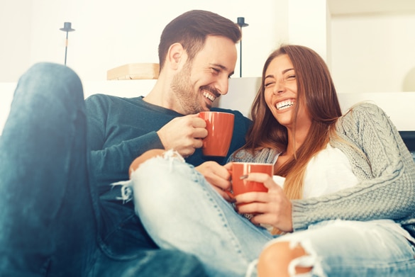 Cheerful young couple in the morning at home - What Does The Aries Man Want In A Relationship