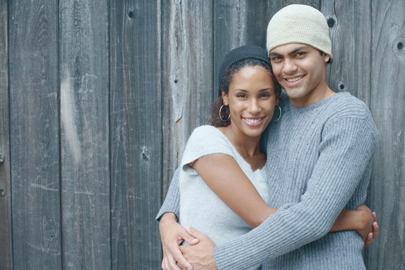 Young couple smiling for the camera - How to Let Your Aries Man Know How you Feel