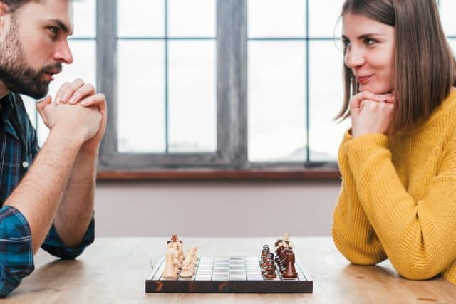 Couple Playing A Competitive Game - Date Night Ideas With An Aries Man